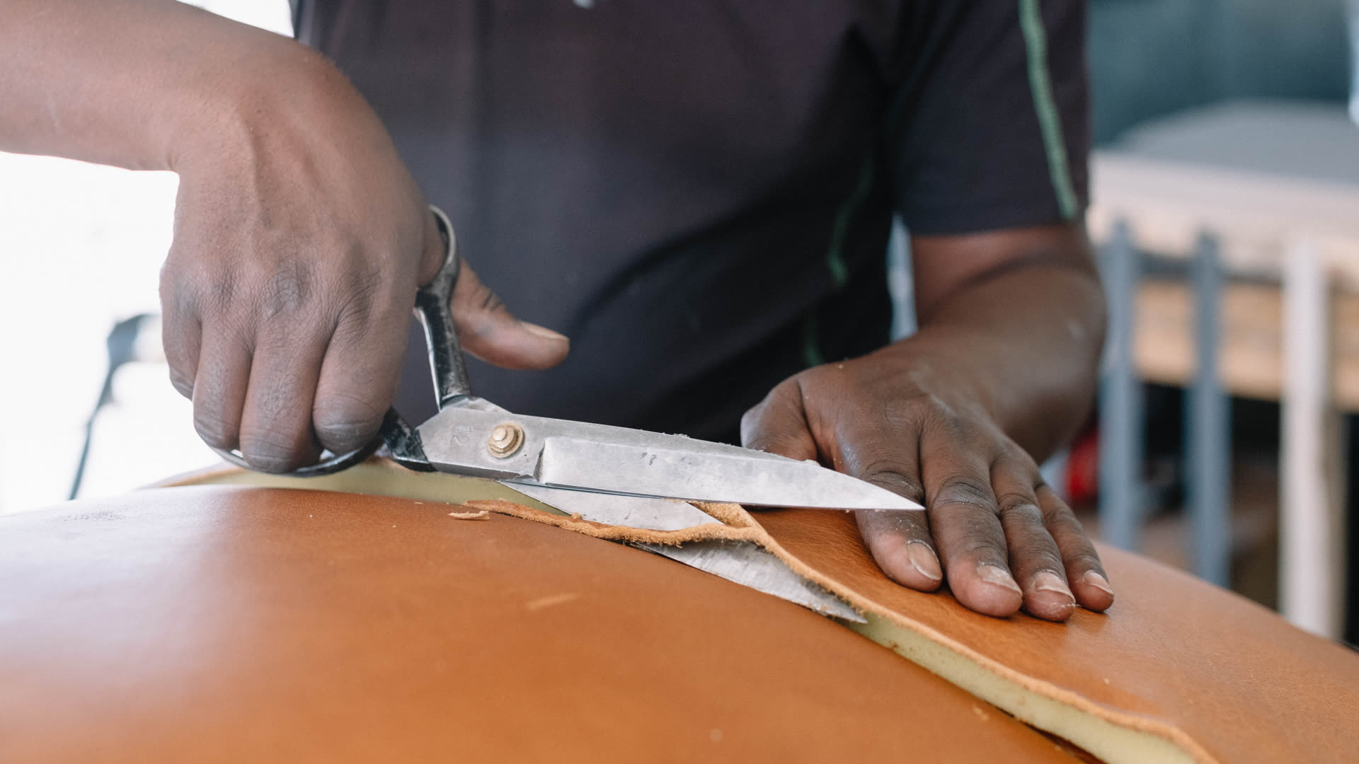 D3 craftsman cutting leather for custom furniture