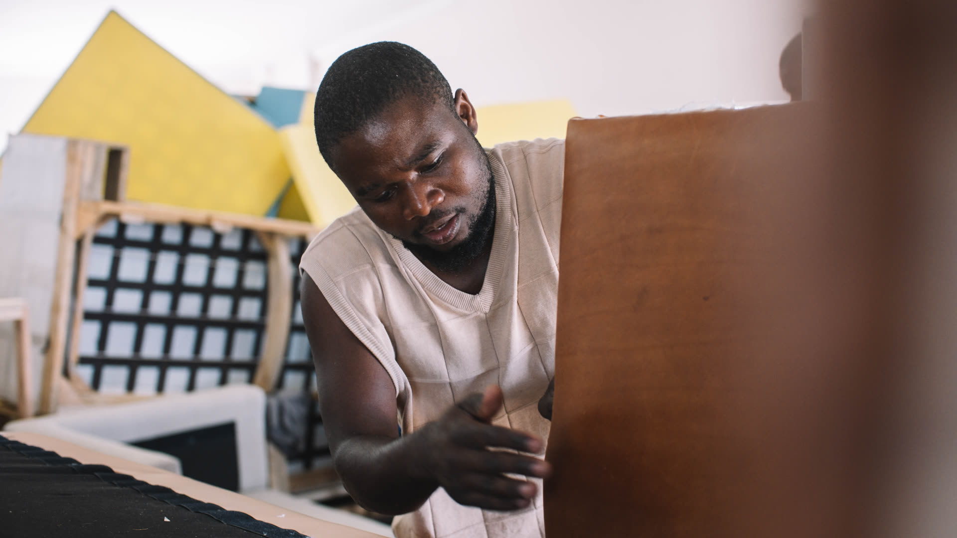 D3 craftsperson working on upholstery detail