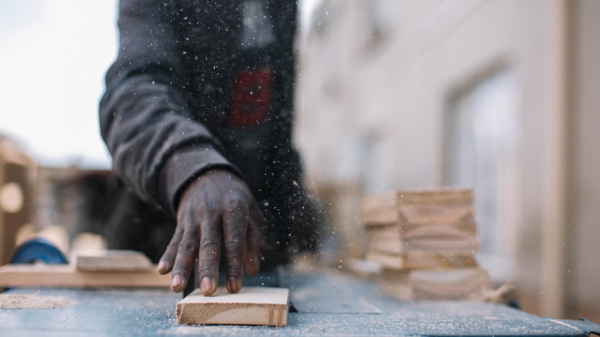 D3 craftsman sanding timber in the workshop