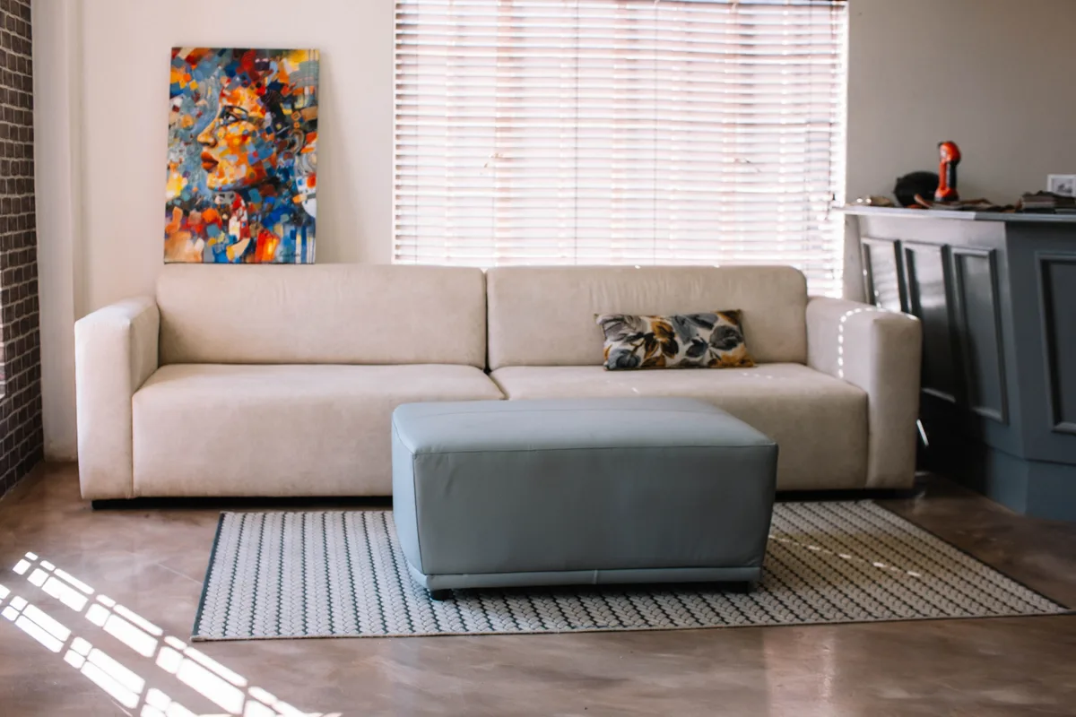 D3 finished couch and ottoman in a styled room